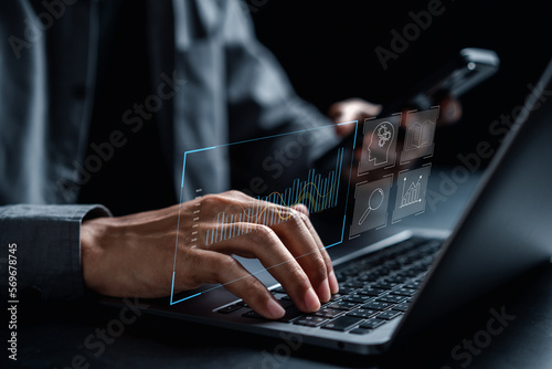 Analyst working with computer and education Management System to make report with KPI and metrics connected to database. Corporate strategy for finance, operations, sales, marketing.