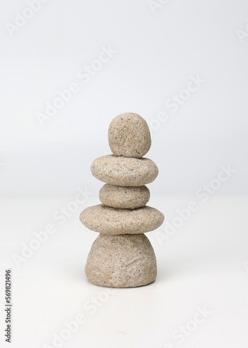 Zen stack of stones on white background