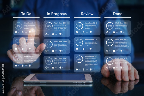 Agile software development or project management using kanban or scrum methodology boards on screen. Process, workflow, visual organisation tools and framework. Developer touching virtual interface.