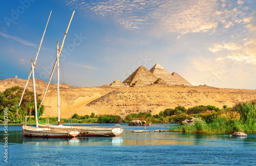 Landscape of Aswan with sailboats in the Nile on the way to pyramids, Egypt