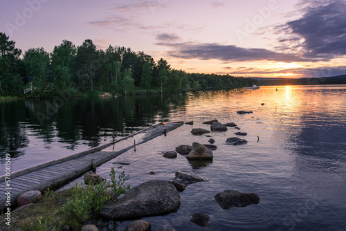 Peaceful landscape of Lake Inari with the midnight sun in Lapland, Finland