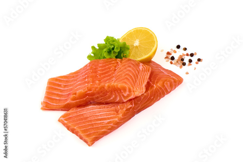 Fresh salmon fillets with lemon isolated on white background.