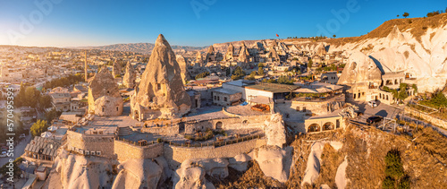 Aerial view of Hotels and houses carved into the rocks of soft volcanic tuff in Cappadocia - one of the wonders of the world in Turkey.