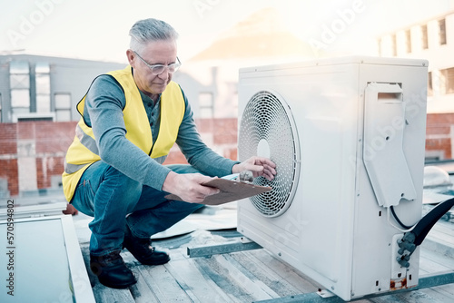 Engineer on rooftop, air conditioning and technician with clipboard, maintenance or repair machine. Male, worker or handyman with document, checklist or confirm working fan hvac for quality assurance