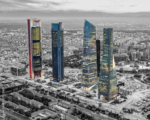 The 5 towers of Madrid in color, with the background in black and white during a sunset