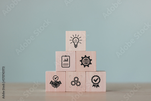 Wooden cubes with marks on the desk. Copyright or patent, intellectual property. Patented brand identity license product copyright. Granting of a property right by a sovereign authority to an inventor