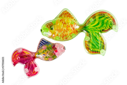 Two toy fish on a white background. Big and small plastic fish.