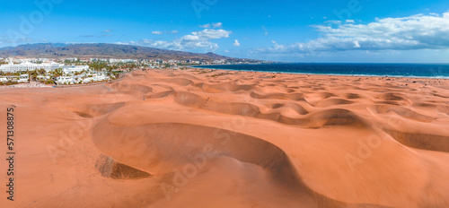 Panoramic aerial scene of the Maspalomas Dunes in Playa del Ingles, Maspalomas, Gran Canaria, Spain. Endless desert sands. Magical safari dunes.