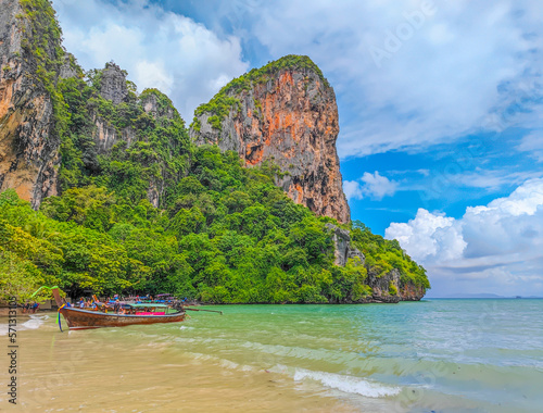 Exotic Railay beach in Thailand with long tail boats parked