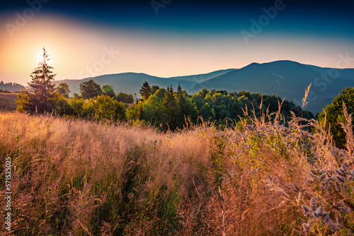 Dramatic sunrise on valley of Lacul Dragan lake, Cluj County, Romania. Picturesque summer scene on Apuseni Mountains. Beauty of nature concept background.