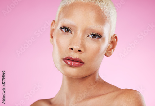 Woman, face and beauty makeup in skincare cosmetics for facial or spa treatment against a pink studio background. Portrait of beautiful female model with cosmetic lip stick for self love or care
