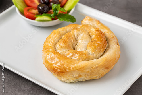 Traditional Turkish pastry made with spinach and cheese wrapped in phyllo. Turkish name gul boregi or gul borek
