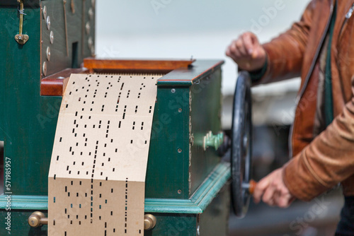 Man playing with a barrel organ