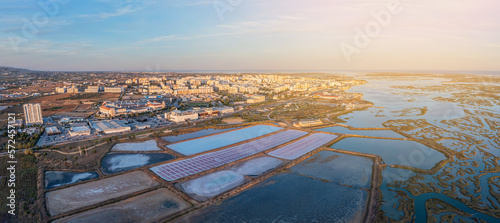 Aerial view of the Ria Formosa park with salt pans in the Portuguese city of Faro. Sunny day