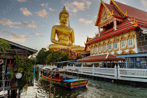 Golden big Buddha head. Big Buddha of Paknam Temple in Bangkok. Religion famous tourist place.
