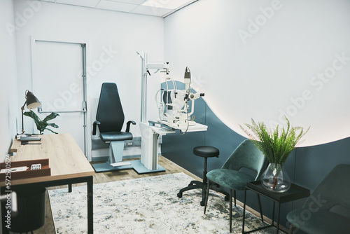 Healthcare, ophthalmology and laser in empty room of clinic for eye exam, laser and consulting. Medical, technology and interior design with nobody and machine in office for optometry and medicine