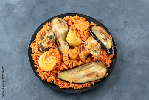 Thieboudienne is a traditional dish from Senegal. Prepared with fish, rice and tomato sauce cooked in one pot.