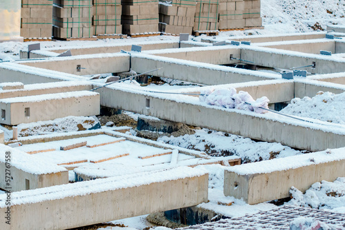 Building foundation made of prestressed concrete beams in the winter