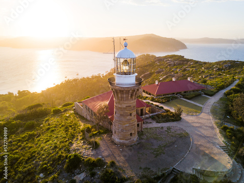 Hill top of Barrenjoey head of Sydney Pacific coast with the lighthouse overlooking palm beach on a sunny day.