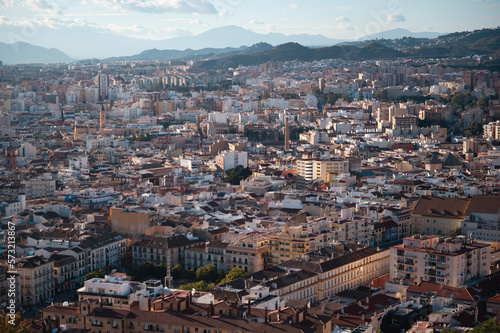 Capture the breathtaking Malaga cityscape from the hilltop fortress of Castillo de Gibralfaro. The panoramic view showcases the city's unique architecture, historic landmarks, and stunning coastline.