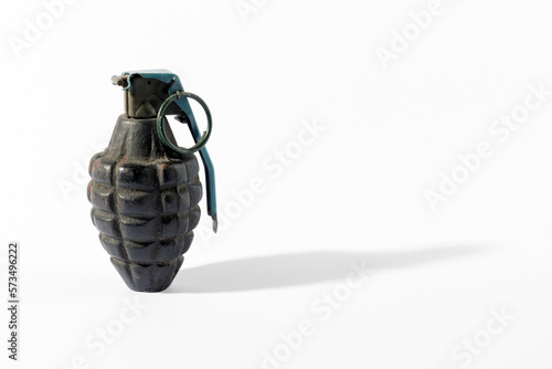 Old grenade on white background