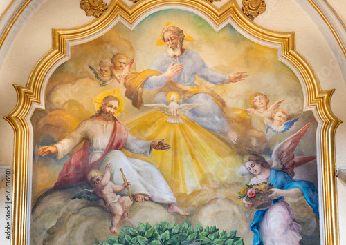 VALENCIA, SPAIN - FEBRUAR 17, 2022: The fresco of Holy Trinity in the church Iglesia de San Marítn from 20. cent.