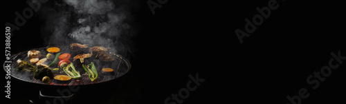 Green grilling. Various vegetables - artichokes, peppers, eggplants are grilled. Proper, vegan nutrition. Dark background. Banner. Place for text.