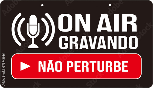A sign that says in Portuguese language : on air do not disturb