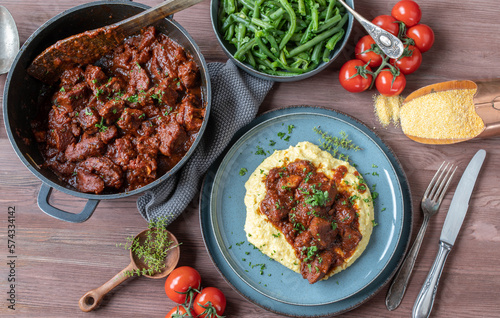 Pork stew with creamy polenta and green beans. Delicious gluten free sunday or holiday meat dish
