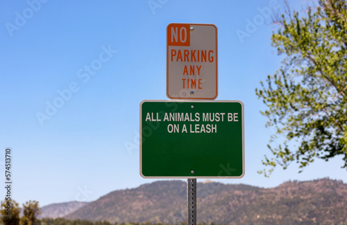 No parking any time and all animals must be on a leash signs.
