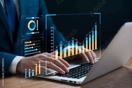 businessman analyzing business Enterprise data management, business analytics with charts, metrics and KPIs to improve organizational performance, marketing, financial organization strategy.