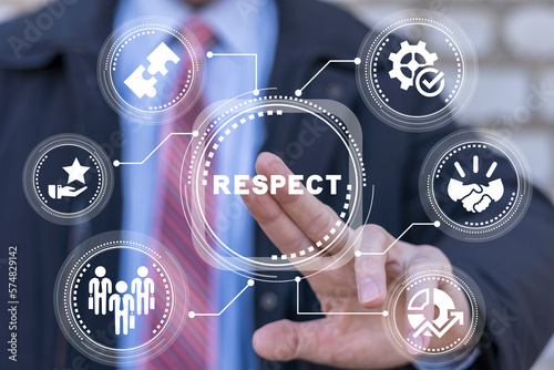 Businessman using virtual touch screen presses text button: RESPECT. Business concept of respect and trust. Give and get respect.