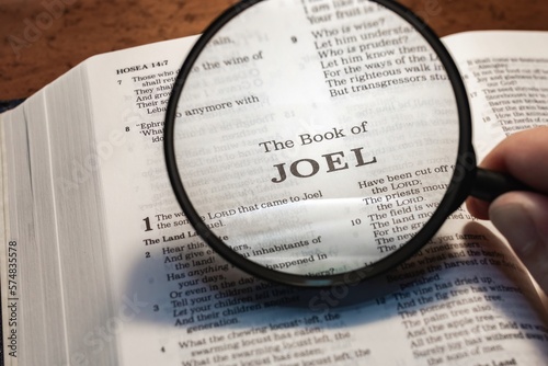 title page book of joel close up using magnifying glass in the bible or Torah for faith, christian, hebrew, israelite, history, religion, christianity, Old Testament