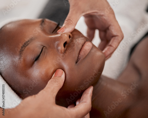 Black woman, relax massage and facial spa treatment of a young female face with serum. Skincare, beauty and wellness clinic with client feeling calm and zen from dermatology or cosmetic chemical peel