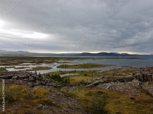 Lake view with mountains in the horizon on a cloudy day at Thingvellir National Park in Iceland