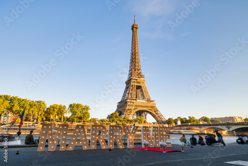 Marriage proposal with the inscription marry me in front of the Eiffel Tower in Paris, France