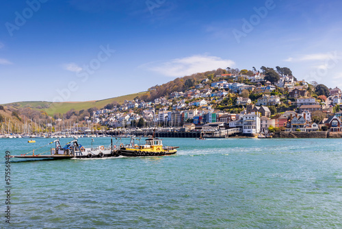 The Dartmouth to Kingswear lower car ferry crossing the River Dart in Devon, with the picturesque village of Kingswear in the background.