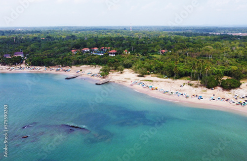 Aerial view of the tropical ocean landscape with a beach. Beautiful southern sea wallpaper for tourism and advertising. Asian landscape, drone photo