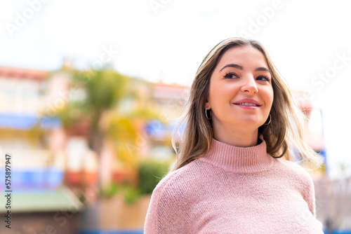 Young pretty Romanian woman at outdoors . Portrait