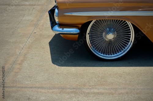 Orange vintage car with silver rims