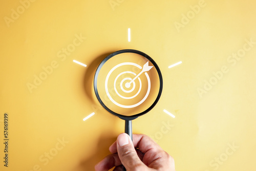 Magnifier glass focus to target objective with idea creative light bulb icon. planning development leadership and customer target group concept...