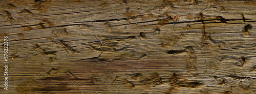 Naturalne tło, struktura drewna, z wyraźnymi śladami użytkowania, abstrakcyjna faktura.