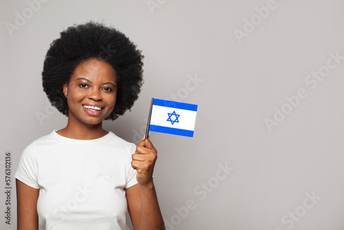 Izraeli woman holding flag of Izrael. Education, business, citizenship and patriotism concept