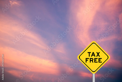 Yellow transportation sign with word tax free on violet color sky background