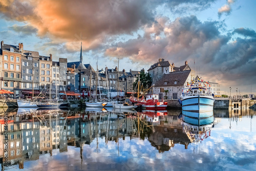 Honfleur, beautiful city in France, the harbor at sunrise, reflection on the river 