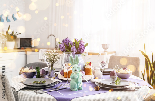 Festive table setting for Easter celebration in kitchen