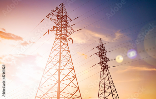 high-voltage power lines (power transmission tower) at sunset