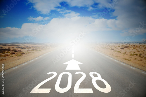 2028 - empty road on a desert and clouds on a sky