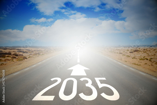 2035 - empty road on a desert and clouds on a sky