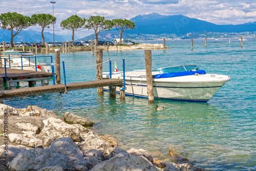 Boat near the pier on Lake Garda in Italy